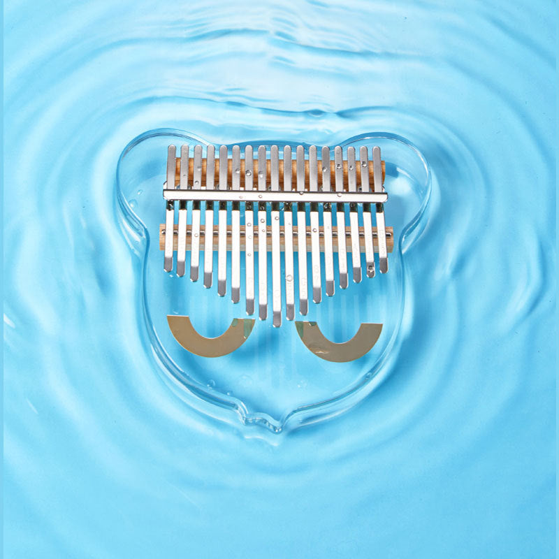 Transparent crystal thumb piano